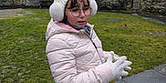 Abygail participe au concours pour gagner de l'argent avec cette photo : casual_wear, child, cold_weather, curly_hair, daylight, earmuffs, glasses, gloves, grass, hat, jacket, nature, outdoor, pavement, portrait, scenic, standing, stone_wall, winter_clothing, young_person