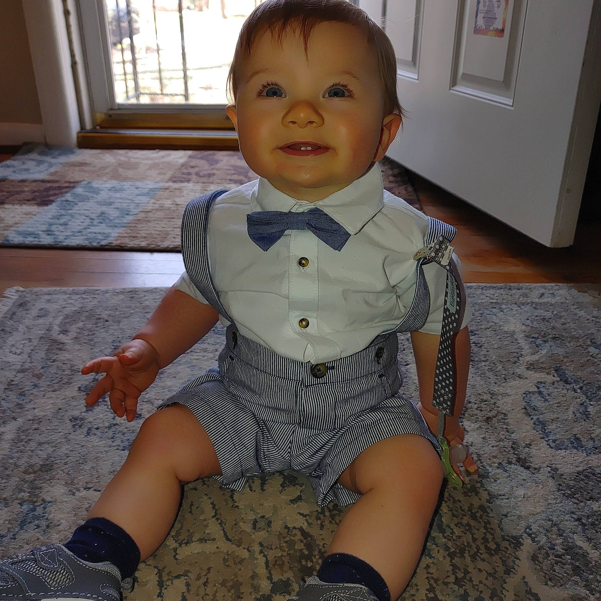 Hunter is registered to the contest to win money with this photo: baby, baby_toddler_clothing, cheek, chest, day_dress, fashion_design, flooring, head, human_body, human_leg, neck, outerwear, pattern, person, skin, sleeve, thigh, toddler, trunk, waist