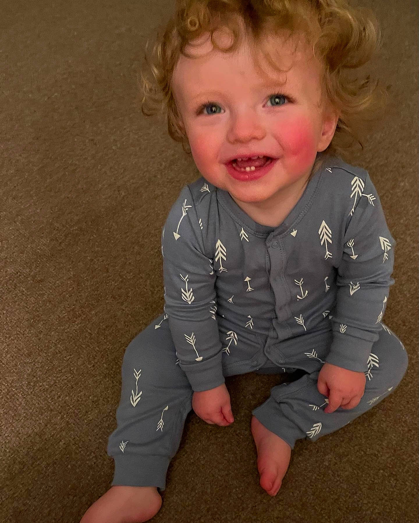 Landon is registered to the contest to win money with this photo: arm, baby_toddler_clothing, cheek, chin, eye, facial_expression, gesture, hairstyle, happy, head, human_body, iris, joy, lip, neck, nose, person, skin, sleeve, smile