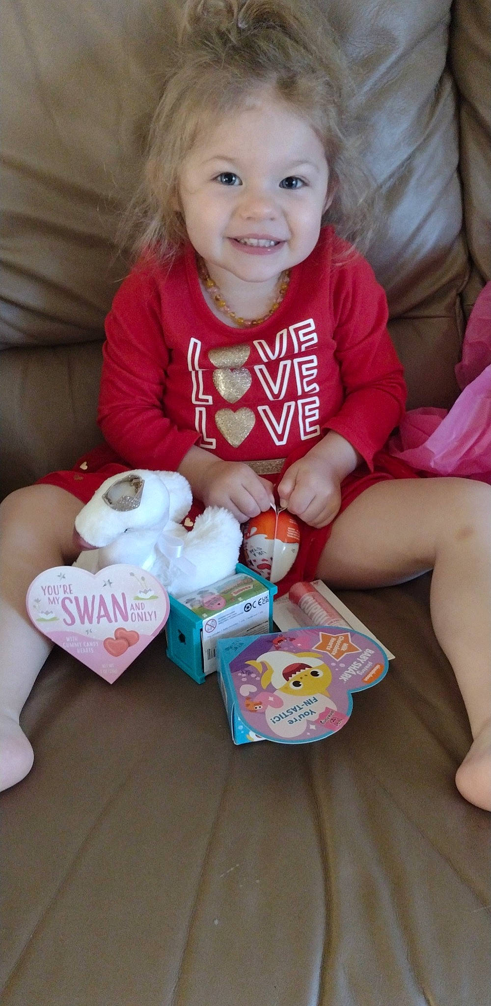 Laney is registered to the contest to win money with this photo: baby, baby_toddler_clothing, blond, child, comfort, eye, finger, fun, happy, joy, lap, nail, person, pink, sharing, sitting, skin, sleeve, smile, sock