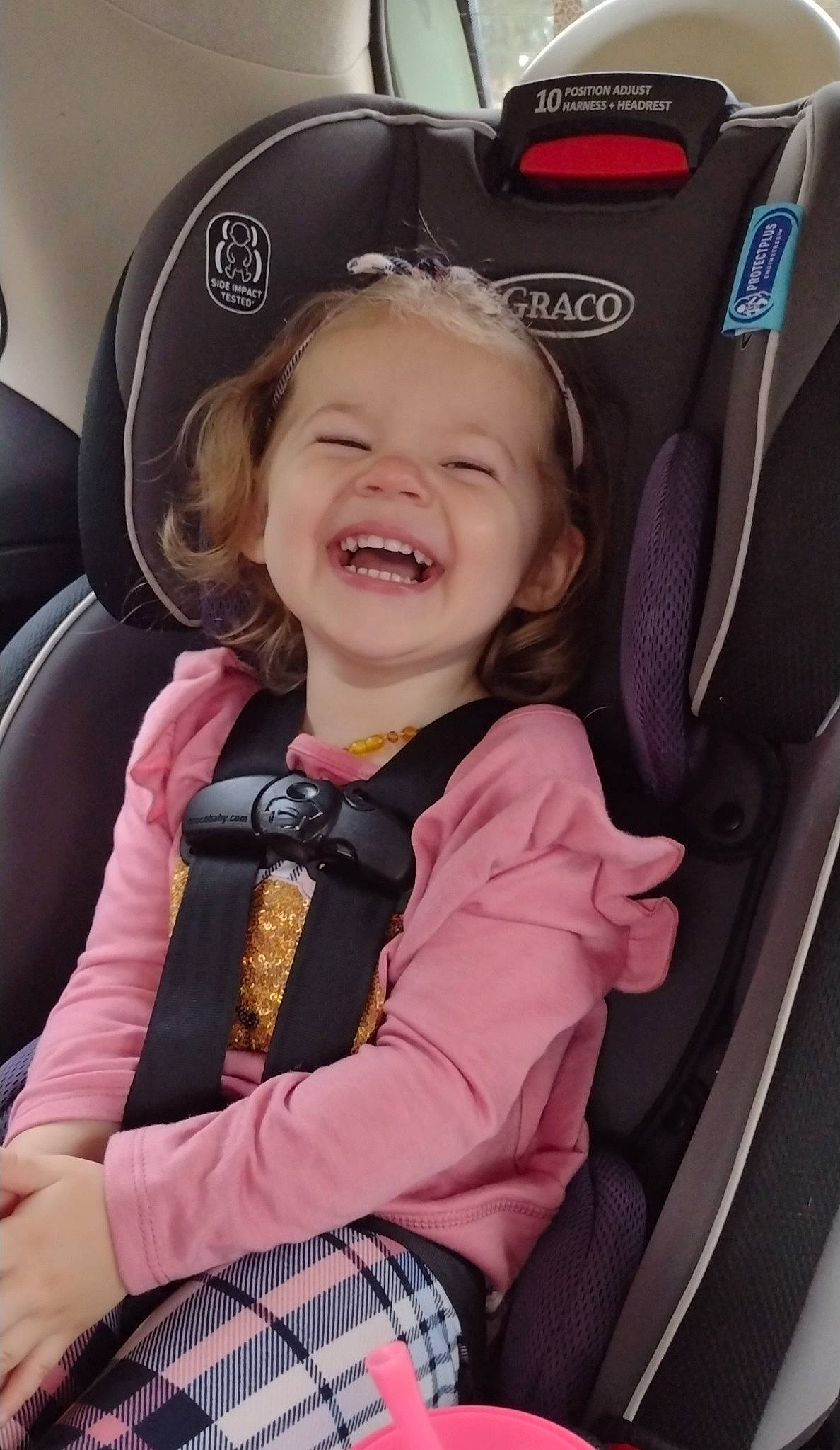 Laney joined the competition — help win amazing prizes! auto_part, automotive_design, baby_carriage, blond, car_seat, car_seat_cover, child, comfort, face, family_car, fun, head_restraint, joy, luxury_vehicle, motor_vehicle, person, plant, product, smile, steering_wheel