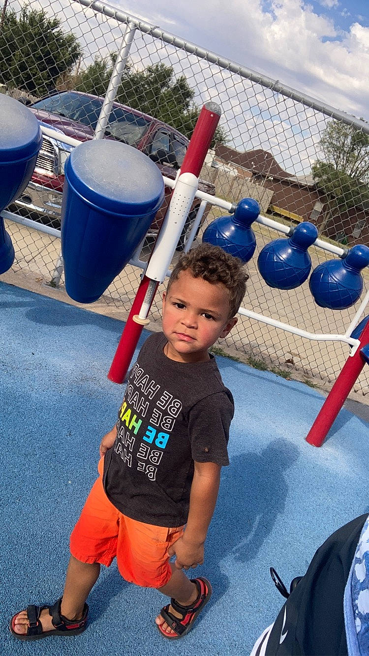 Aaron is registered to the contest to win money with this photo: blue, child, city, cloud, electric_blue, fun, gas, happy, leisure, outdoor_play_equipment, person, physical_fitness, playground, recreation, shorts, sky, t_shirt, toddler, vacation, waste_container
