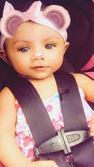 Kyloni is registered to the contest to win money with this photo: barbie, brown_hair, cheek, child, child_model, doll, ear, eye, eyebrow, eyelash, face, forehead, hair, head, lip, nose, person, pink, toddler, toy