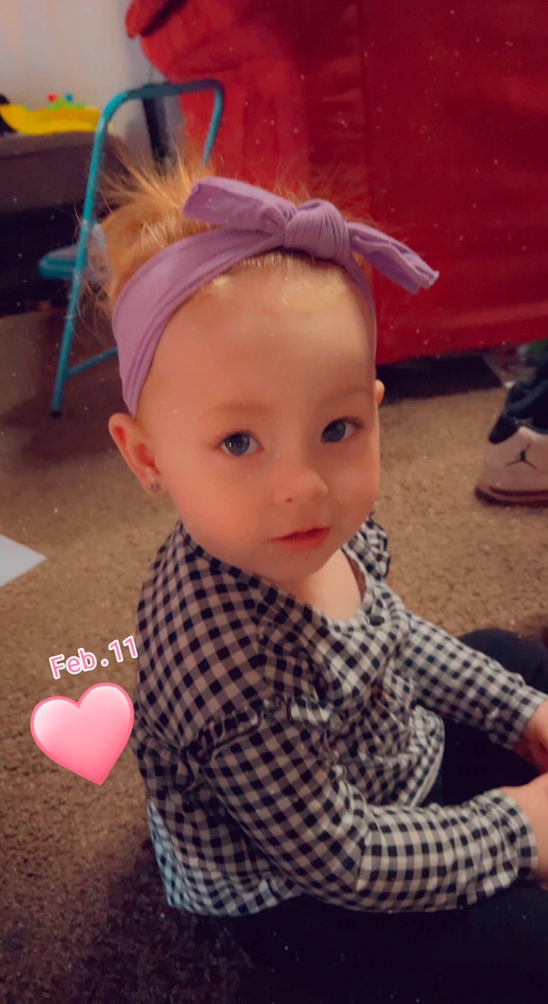 Esmae is registered to the contest to win money with this photo: bangs, child, cool, costume_hat, ear, eyelash, fashion_accessory, fashion_design, hair_coloring, happy, headband, headpiece, magenta, pattern, person, plaid, sitting, skin, sleeve, toddler