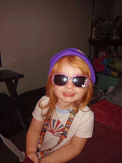 Esmae joined the competition — help win amazing prizes! bangs, black_hair, chin, cool, eyewear, facial_expression, fashion_design, glasses, goggles, happy, human_body, lip, long_hair, magenta, mouth, person, personal_protective_equipment, skin, sunglasses, toddler