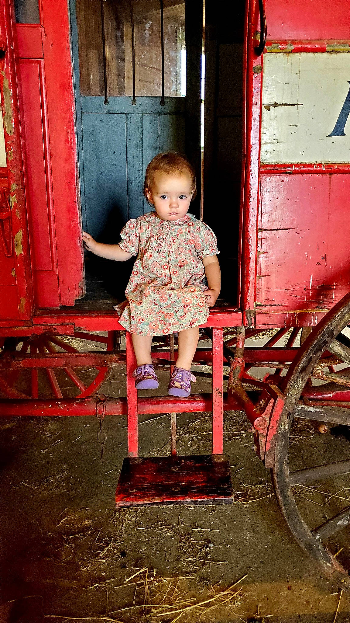 Susie joined the competition — help win amazing prizes! baby, baby_toddler_clothing, chair, child, door, flooring, fun, magenta, motor_vehicle, person, pink, product, red, rolling, sitting, standing, tints_and_shades, tire, toddler, wheel