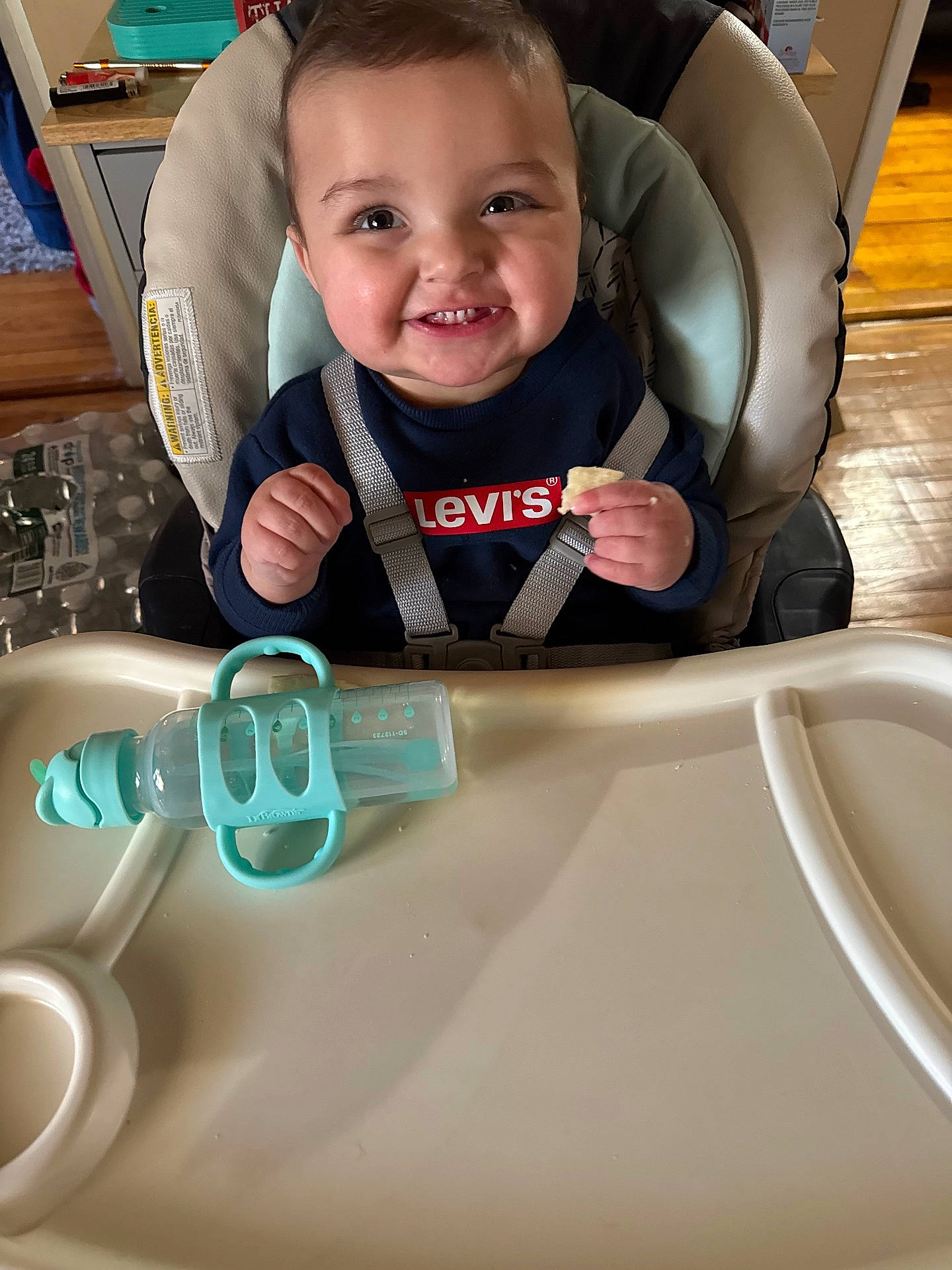 baby, bodypart, chair, cream, cutlery, dessert, face, finger, food, fork, furniture, hand, happy, head, icecream, person, photography, portrait, smile, spoon