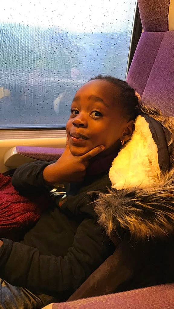 Mary-york participe au concours pour gagner de l'argent avec cette photo : afro, black_hair, child, cloud, event, face, flash_photography, fun, fur, gesture, happy, human, leisure, person, room, sitting, smile, tints_and_shades, toddler