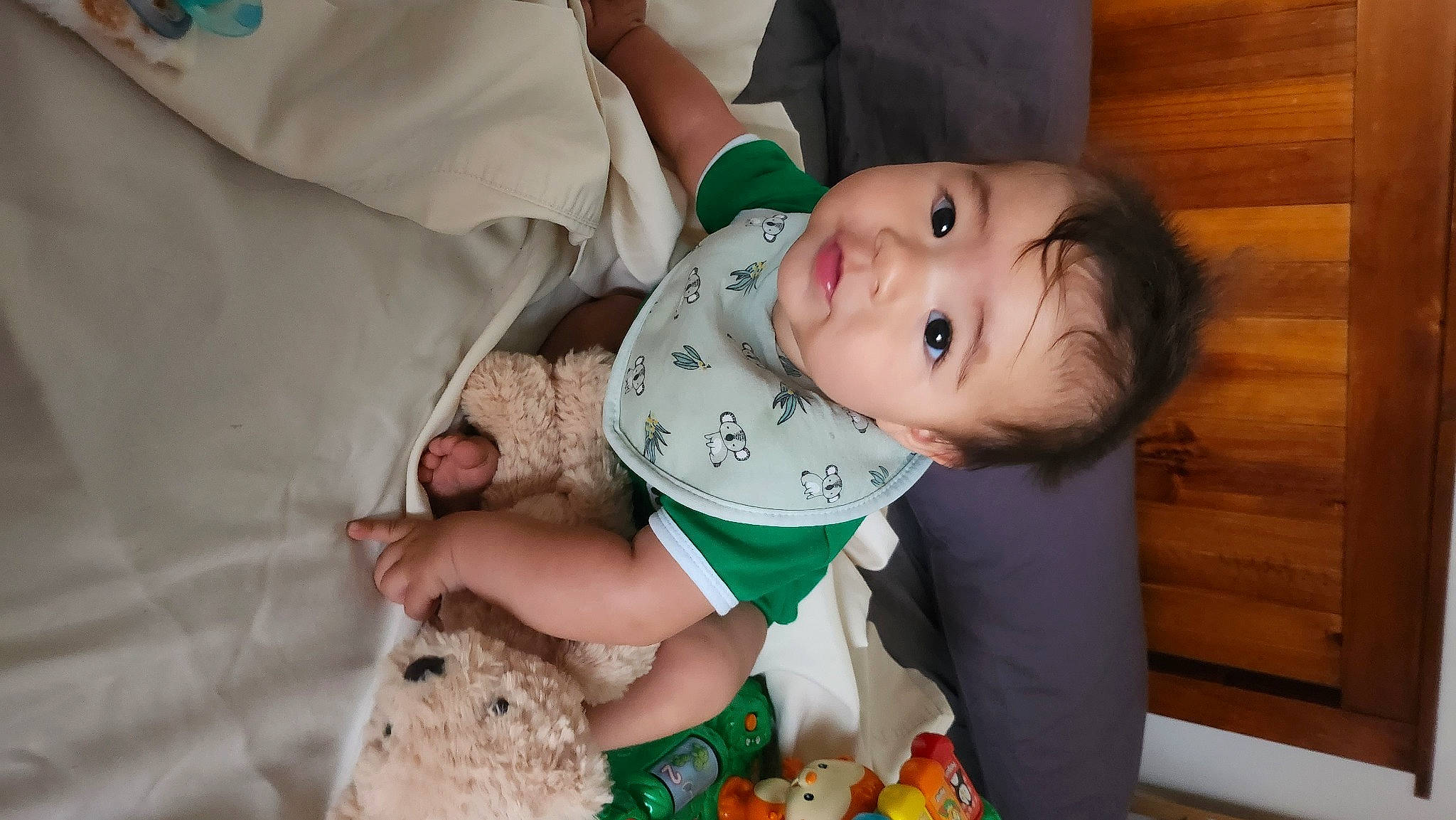 Jeffrey is registered to the contest to win money with this photo: arm, baby, baby_toddler_clothing, cheek, child, comfort, eye, fun, hand, happy, head, human_body, person, product, room, skin, sleeve, smile, toddler, toy