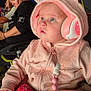 Nova joined the competition — help win amazing prizes! baby, headphones, pink_hoodie, blanket, child, crowd, event, person, blue_eyes, hand, seated, adult, bridge, night, jacket, outdoor, people, listening, cute, warm_clothing