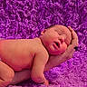 newborn, baby, infant, sleeping, portrait, close_up, face, hands, arms, adult, blanket, purple, fluffy, cozy, indoors, lying_down, diaper, peaceful, candid, photography