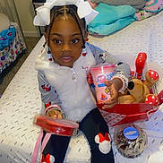 Alayah is registered to the contest to win money with this photo: child, clothing, coat, costume, couch, cushion, face, female, footwear, furniture, girl, head, homedecor, indoors, jacket, pants, person, photography, portrait, shoe