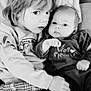 éloïse a rejoint le concours — aidez-le/la à gagner de superbes lots ! child, baby, sibling, couch, plaid_pants, black_and_white, portrait, cozy, clothing, face, cute, indoor, hug, expression, person, young, infant, sitting, cushion, soft