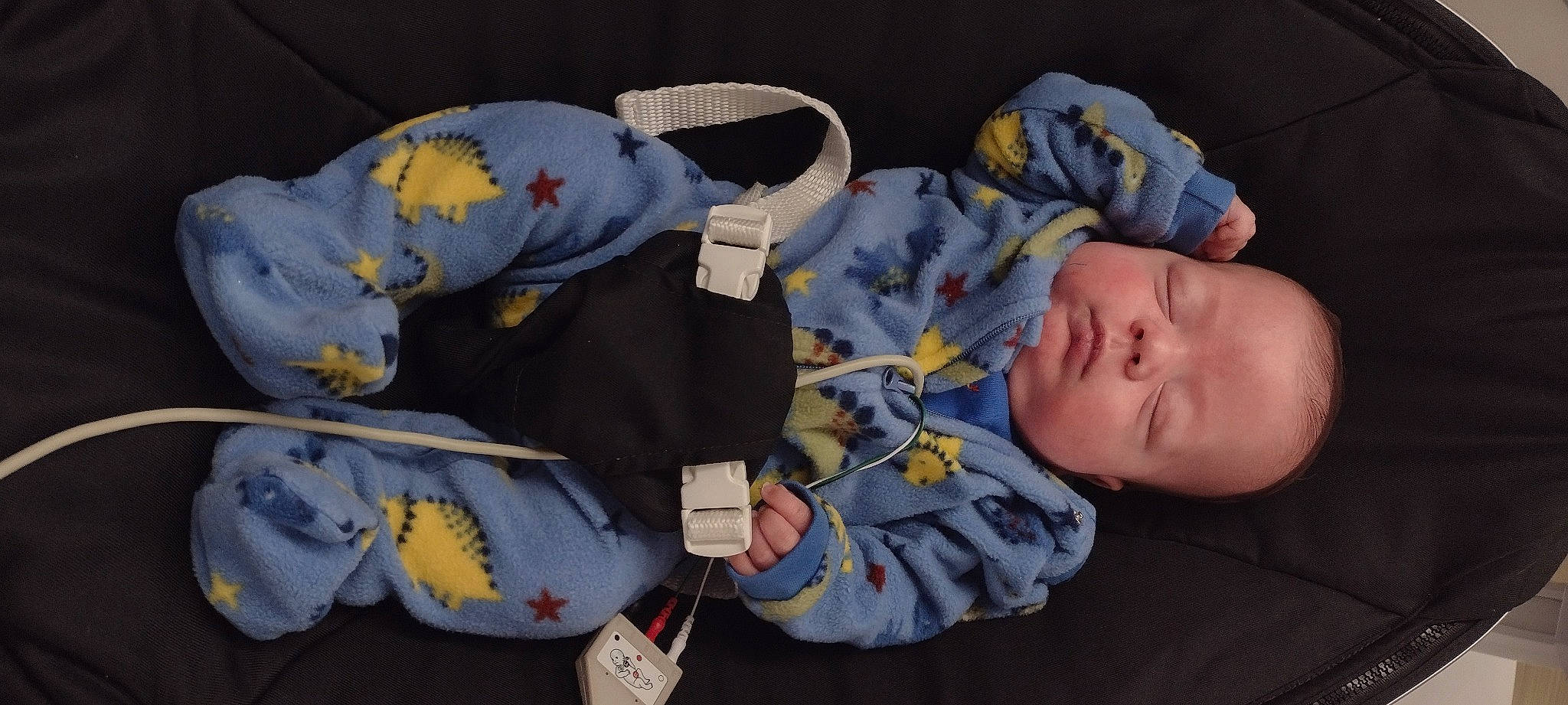 Jaxon is registered to the contest to win money with this photo: baby, baby_products, baby_sleeping, baby_toddler_clothing, child, comfort, electric_blue, hat, nap, person, sitting, textile, toddler