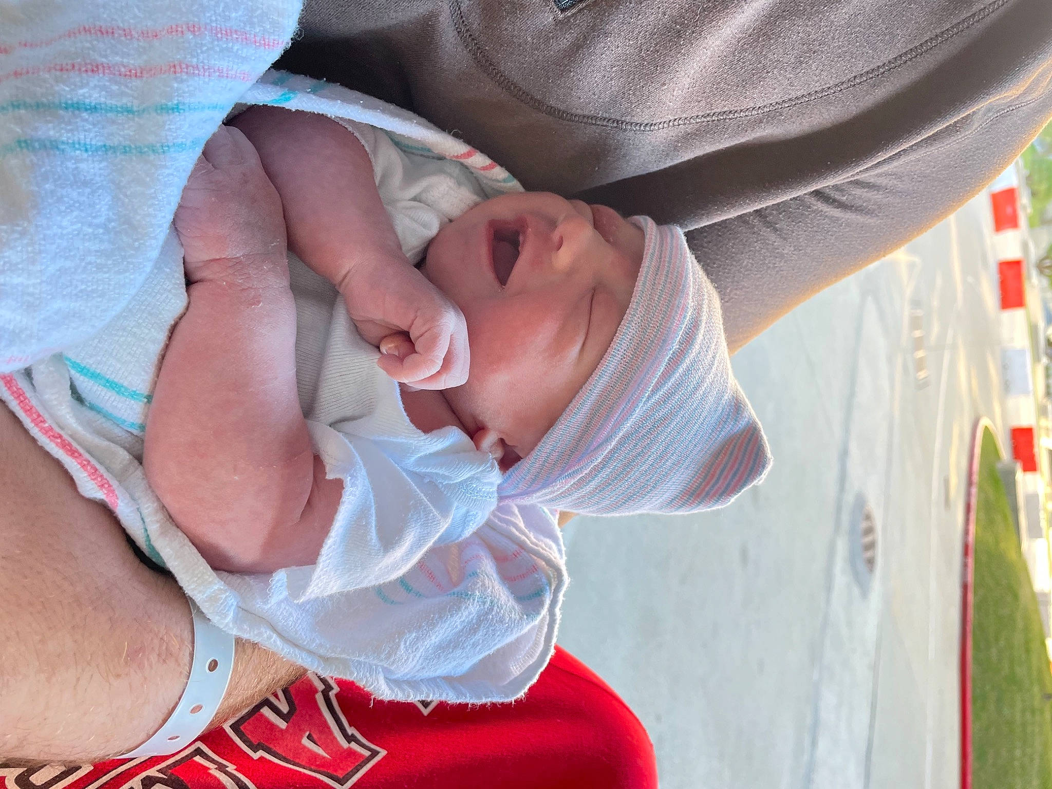 Huntley is registered to the contest to win money with this photo: baby, baby_products, baby_toddler_clothing, child, comfort, elbow, facial_expression, gesture, happy, hat, headwear, mouth, nail, person, plant, skin, thumb, toddler, tree, wrist