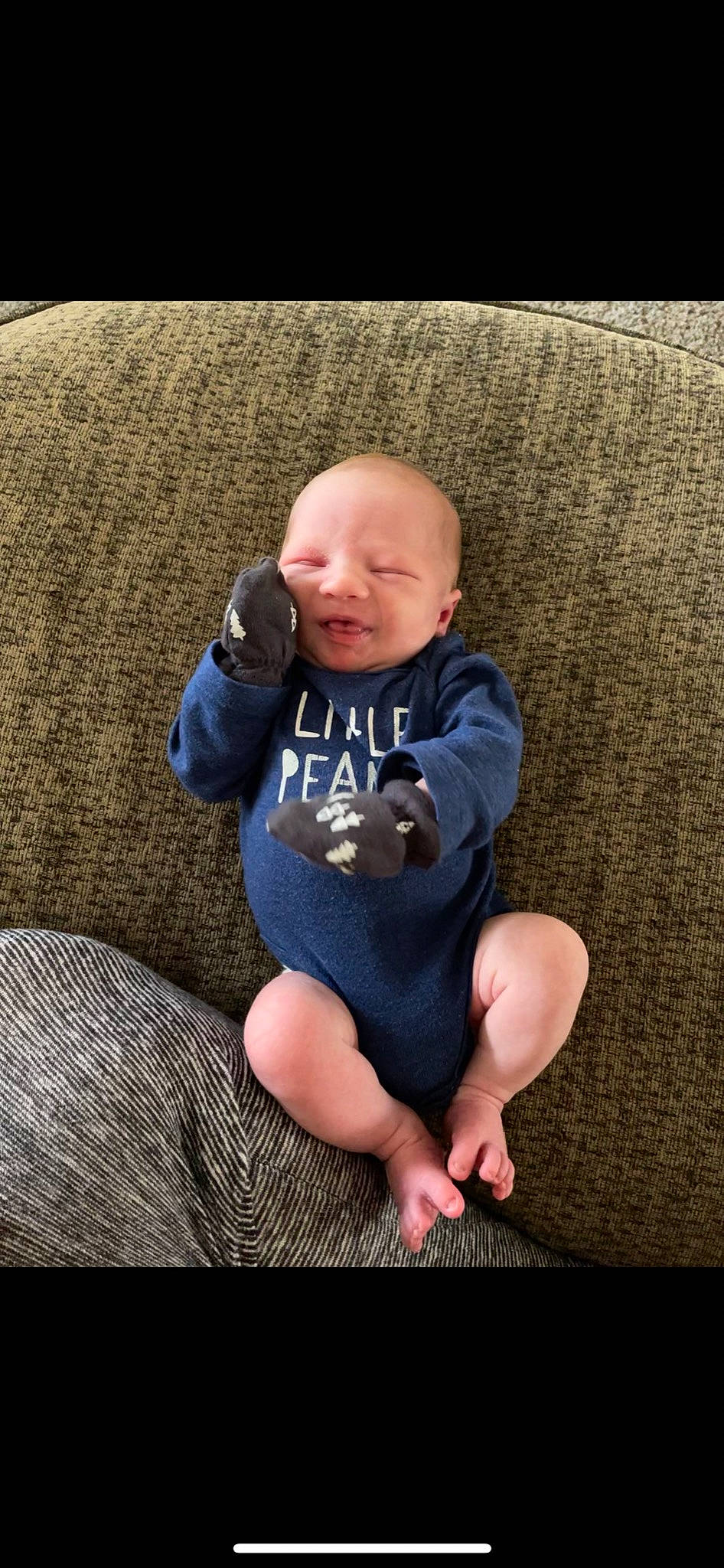 Huntley is registered to the contest to win money with this photo: baby, baby_toddler_clothing, cheek, comfort, eye, flash_photography, grass, grey, happy, human_leg, iris, knee, lap, person, plant, skin, sleeve, t_shirt, thigh, toddler