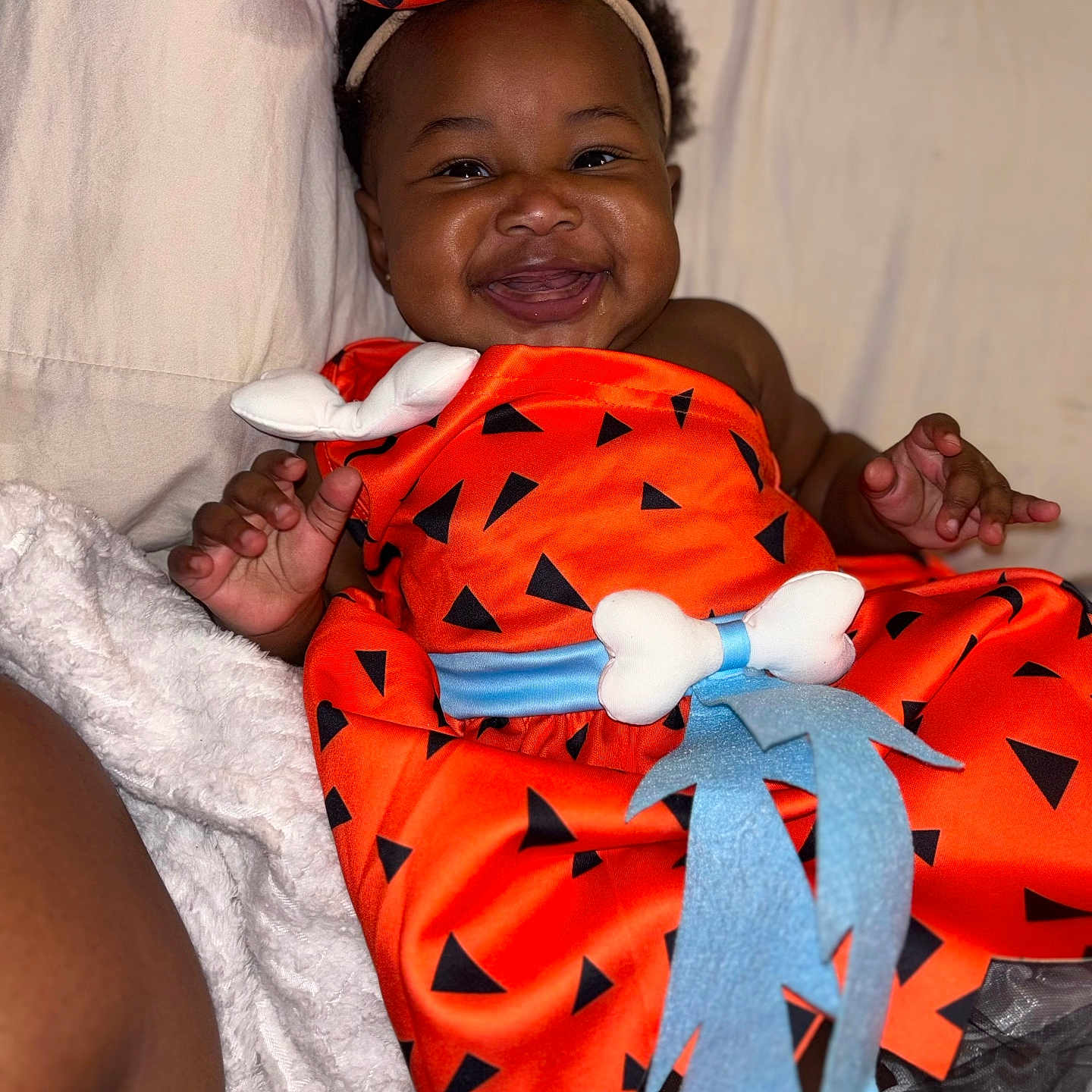 Delayah is registered to the contest to win money with this photo: baby, bed, blanket, bodypart, clothing, couch, dress, face, finger, furniture, hand, happy, head, homedecor, laughing, newborn, person, photography, portrait, smile