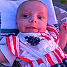 Asaiah joined the competition — help win amazing prizes! american_flag_pattern, baby, blue, bow_tie, closeup, clothing, cute, face, infant, outdoor, person, pillow, portrait, red, sitting, smiling, stars, stripes, white, young_child