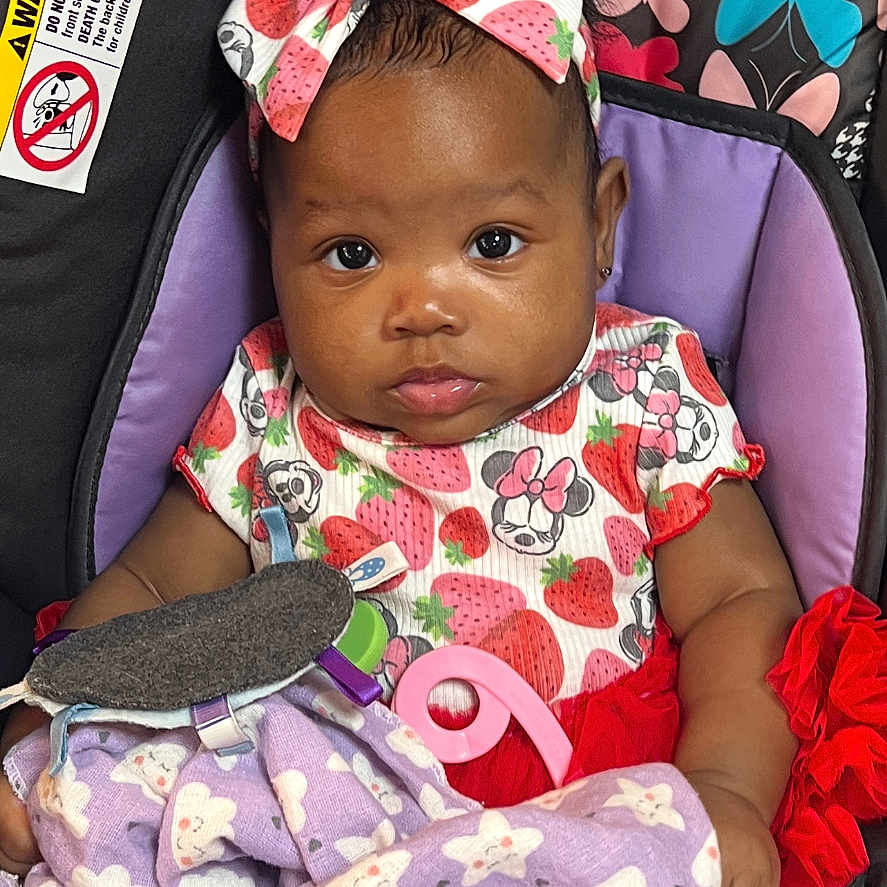 Keiyla joined the competition — help win amazing prizes! baby, blanket, butterfly_pattern, car_seat, child, child_safety_seat, clothing, cute, dress, eyes, face, hands, headband, indoor, infant, number_9, portrait, purple_blanket, strawberry_pattern, toy