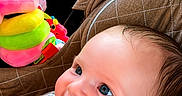 Isla-Mae is registered to the contest to win money with this photo: baby, child, car_seat, smiling, blue_eyes, plush_toy, colorful_toy, quilted_fabric, seatbelt, car_interior, window, greenery, happy, infant, portrait, cute, young_child, side_view, bright, indoors
