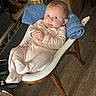 Isla-Mae joined the competition — help win amazing prizes! baby, infant, child, pajamas, chair, wooden_chair, towel, blue_towel, indoor, flooring, wood_floor, box, cardboard_box, curious, looking, relaxed, furniture, closeup, portrait, person