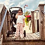 Siyara joined the competition — help win amazing prizes! american_flag, child, cloudy_sky, cute, fashion, flower_pot, handrail, outdoor, person, pink_pants, portrait, shoes, stroller, summer, sunglasses, toddler, walking, white_top, wood, wooden_bridge