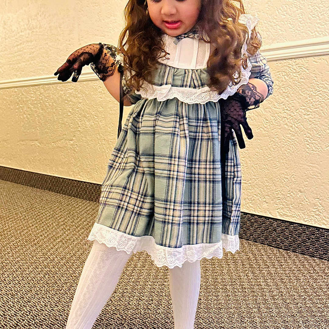 Siyara joined the competition — help win amazing prizes! black_gloves, carpet, child, curly_hair, cute, dress, fashion, floor, girl, headband, indoor, lace, pearl, person, plaid, playful, pose, shoes, wall, white_tights