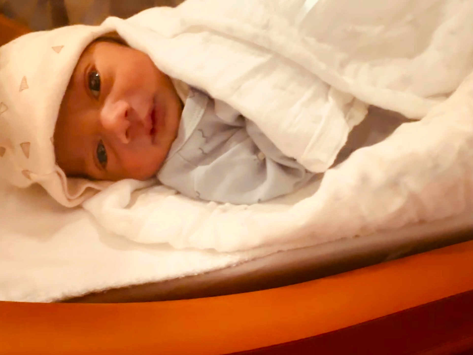 Sihan is registered to the contest to win money with this photo: newborn, baby, blanket, hat, sleepwear, face, infant, wrapped, bed, soft, cozy, cute, indoors, person, portrait, young_child, resting, warm, sleep, closeup