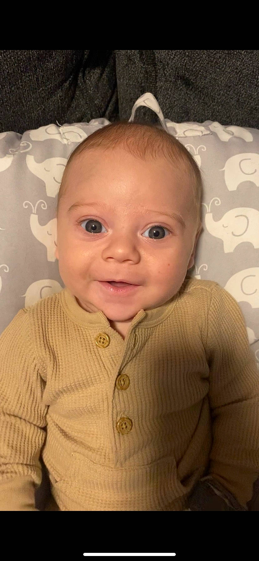 Kaius is registered to the contest to win money with this photo: baby, baby_toddler_clothing, cheek, child, comfort, eyelash, flash_photography, flooring, forehead, fun, happy, iris, lip, mouth, nose, person, sitting, skin, sleeve, smile