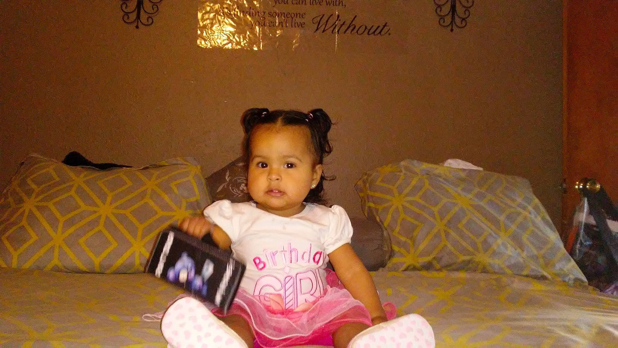 Gabriela is registered to the contest to win money with this photo: baby, child, fun, furniture, person, pink, room, sitting, smile, toddler