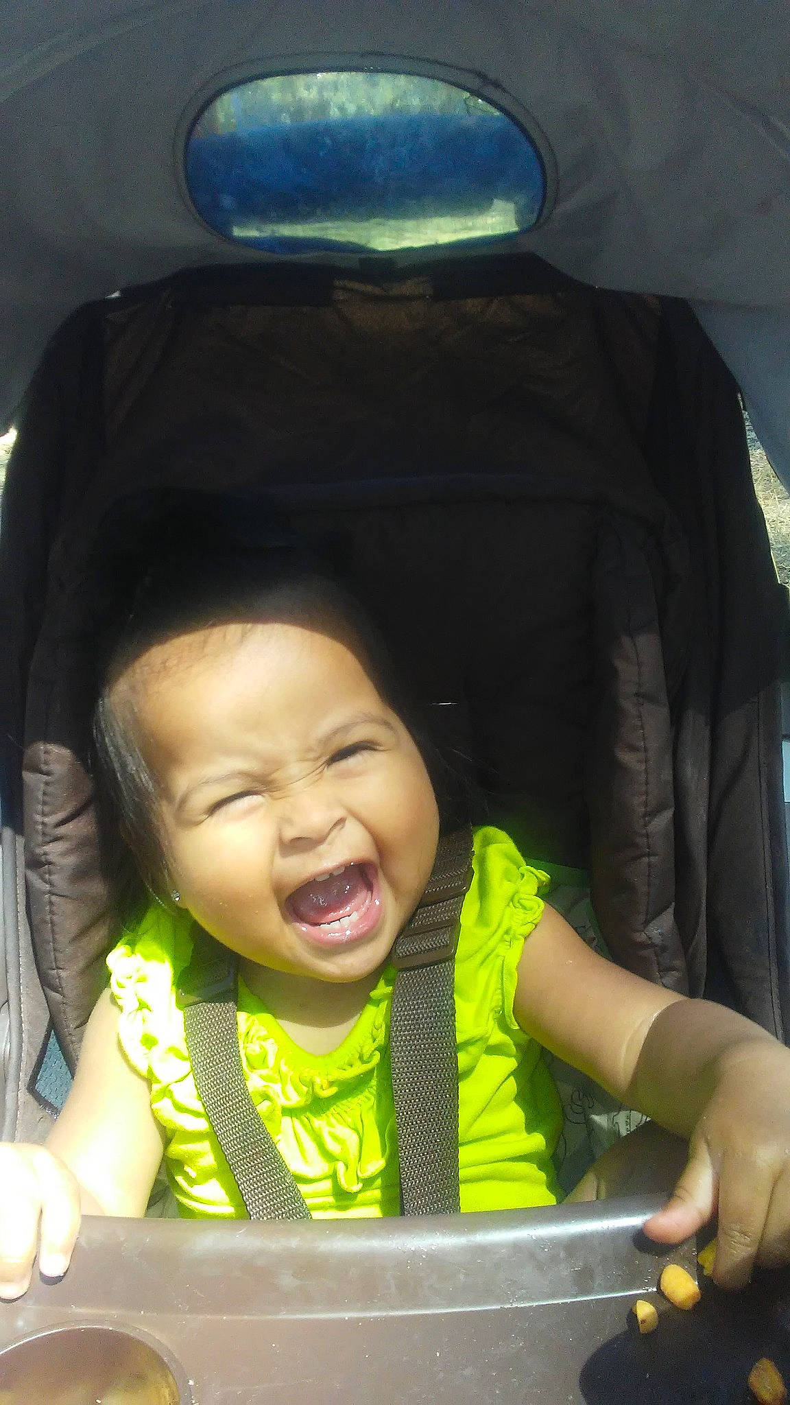 Gabriela joined the competition — help win amazing prizes! black_hair, car, car_seat, child, facial_expression, family_car, forehead, fun, happy, laugh, mouth, nose, person, skin, smile, toddler