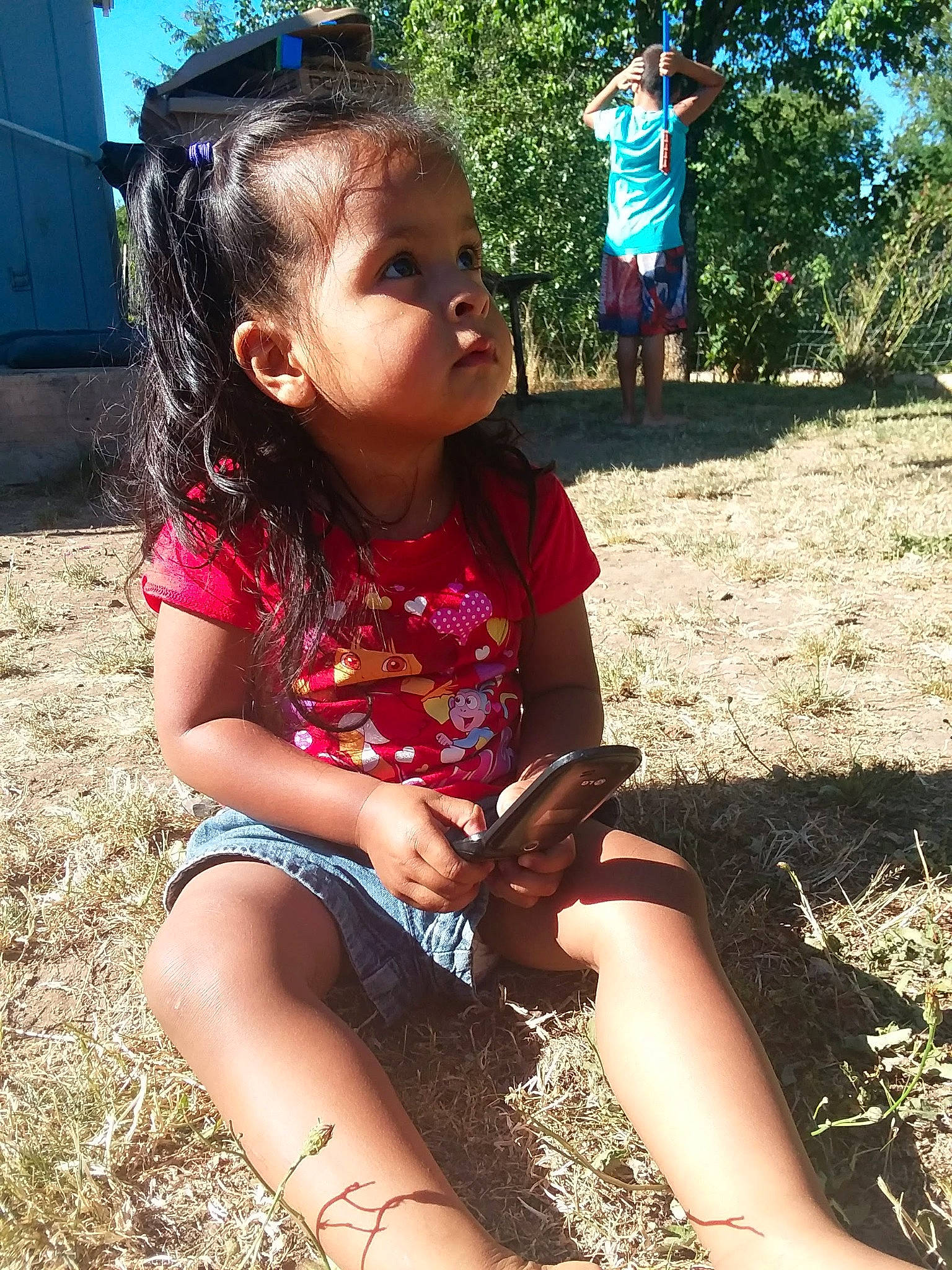 Gabriela joined the competition — help win amazing prizes! adaptation, black_hair, child, child_model, fawn, fun, grass, hair, hairstyle, happy, leg, long_hair, play, sitting, smile, summer, thigh, tree, vacation