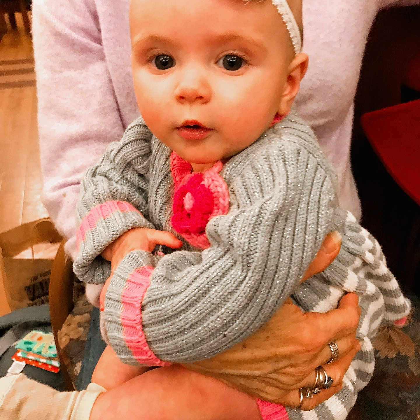 Faith joined the competition — help win amazing prizes! accessories, baby, bodypart, cap, clothing, face, finger, glove, hand, hat, head, jewelry, knitwear, pants, person, photography, portrait, ring, sitting, sweater