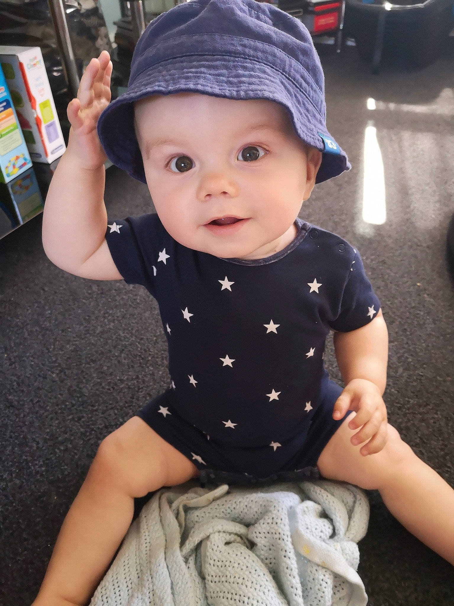 Kyran joined the competition — help win amazing prizes! baby, baby_products, baby_toddler_clothing, cap, child, design, hand, hat, headgear, pattern, person, product, sitting, skin, sleeve, t_shirt, toddler