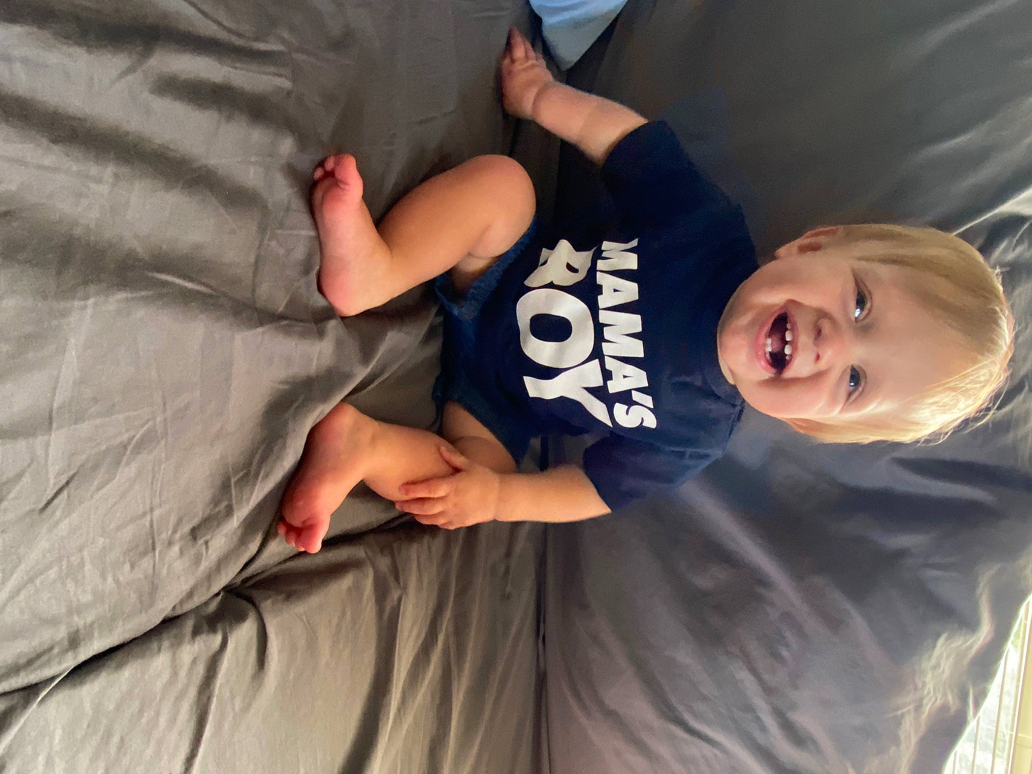 Kolby joined the competition — help win amazing prizes! baby_toddler_clothing, comfort, elbow, finger, fun, gesture, grass, hand, happy, human_body, joint, knee, leg, person, smile, t_shirt, thigh, thumb, toddler, tree