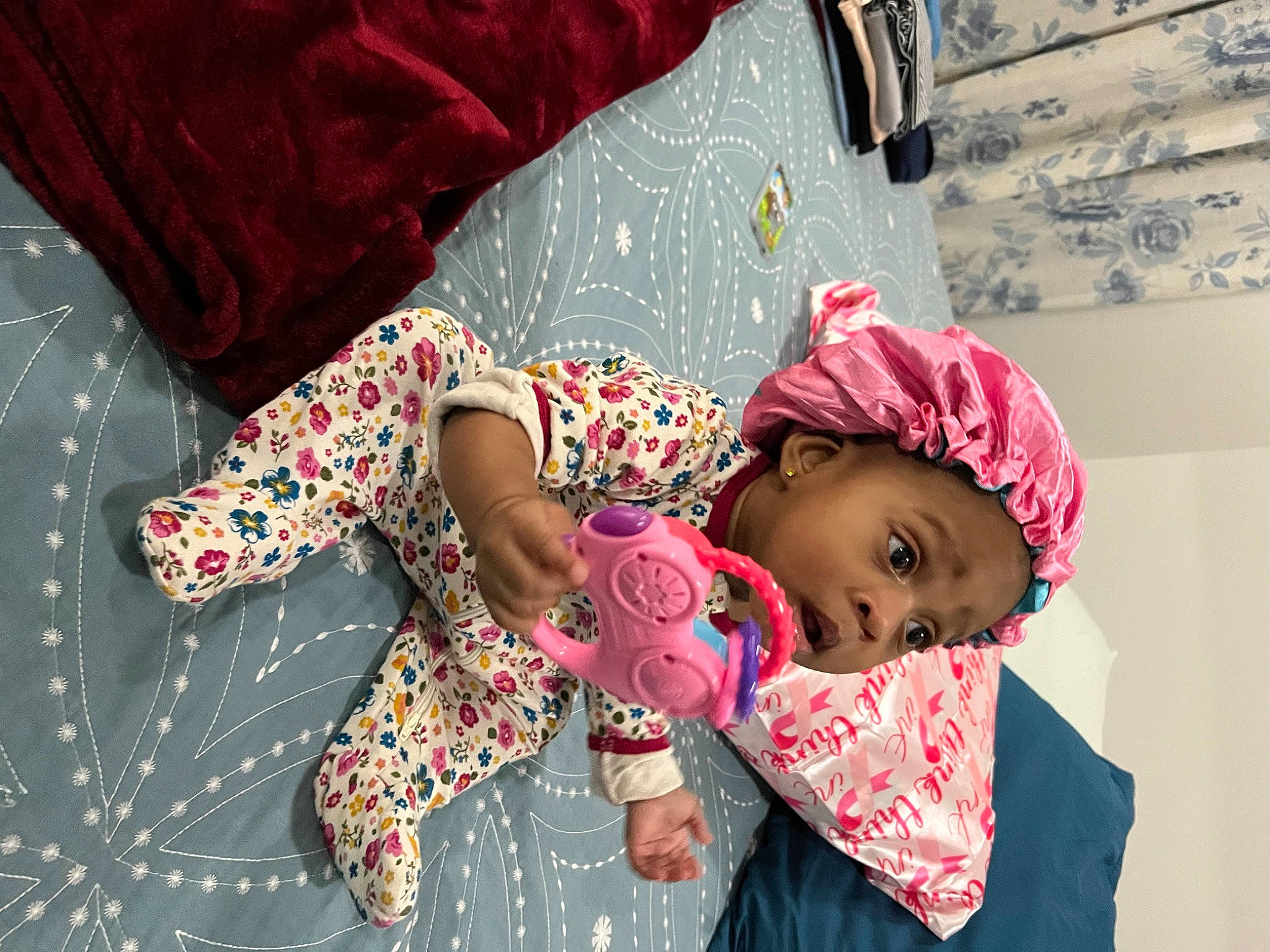 Brookelynn is registered to the contest to win money with this photo: baby, baby_toddler_clothing, child, comfort, event, fun, happy, head, human_leg, linens, magenta, pattern, person, pink, room, skin, sleeve, surprise, textile, toddler