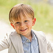 Trevor joined the competition — help win amazing prizes! child, boy, smiling, outdoor, portrait, face, light_blazer, striped_shirt, happy, young, cute, casual_wear, sunlight, natural_light, grass_background, blond_hair, short_hair, arms_outstretched, daytime, closeup