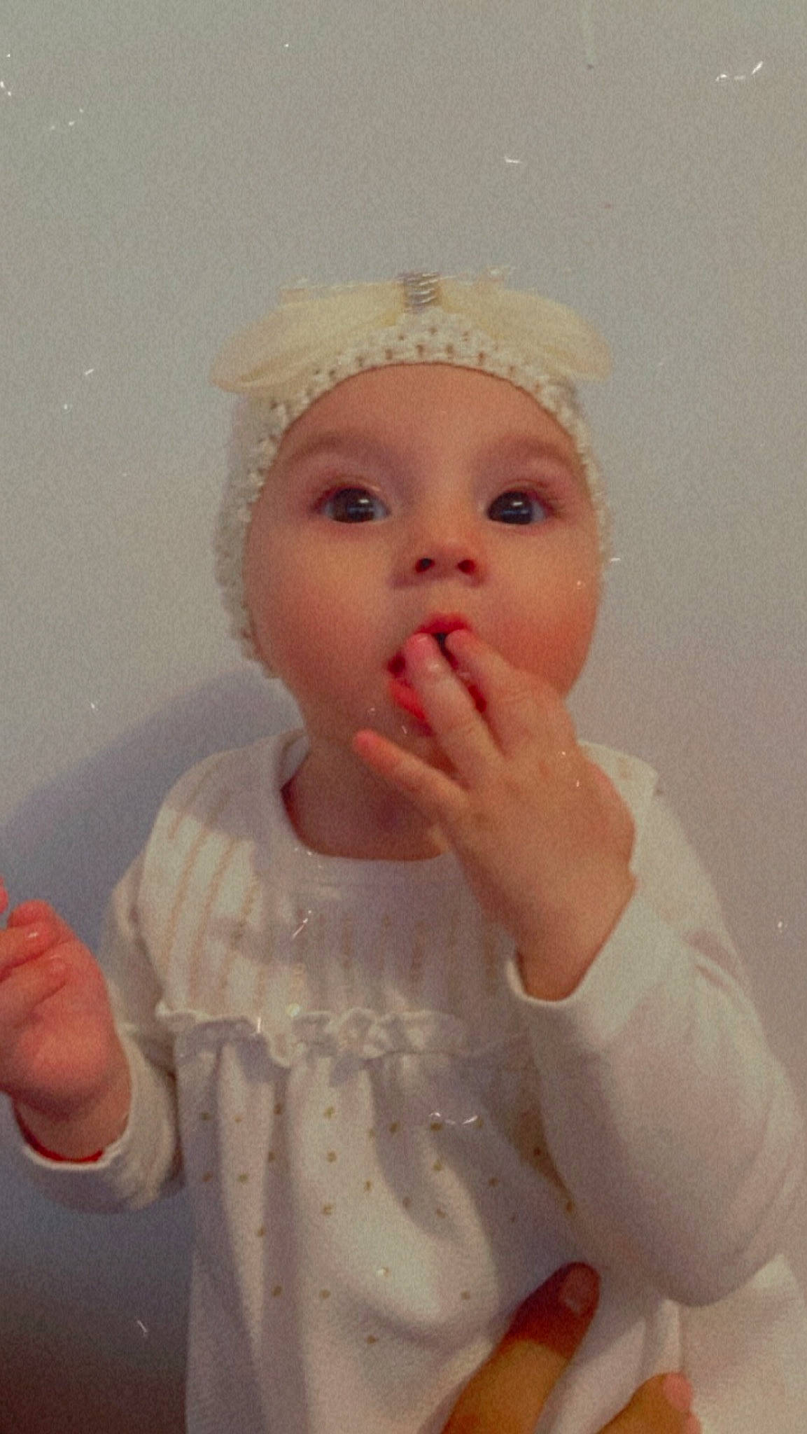 Evelyn participe au concours pour gagner de l'argent avec cette photo : baby, baby_toddler_clothing, cap, cheek, costume_hat, dress, fashion_accessory, finger, gesture, happy, headpiece, iris, lip, nail, nose, person, pink, skin, sleeve, thumb