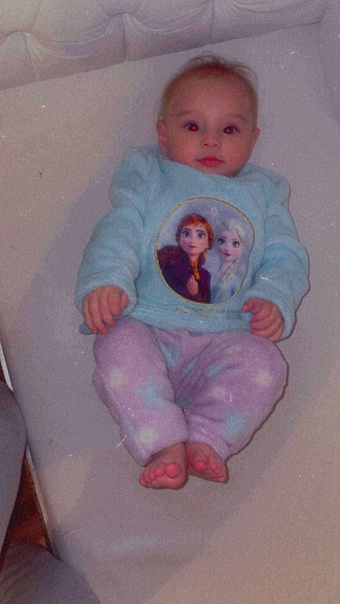 Evelyn participe au concours pour gagner de l'argent avec cette photo : arm, baby, baby_products, baby_toddler_clothing, cheek, child, circle, comfort, foot, head, leg, magenta, organ, person, pink, room, sitting, skin, sleeve, sock