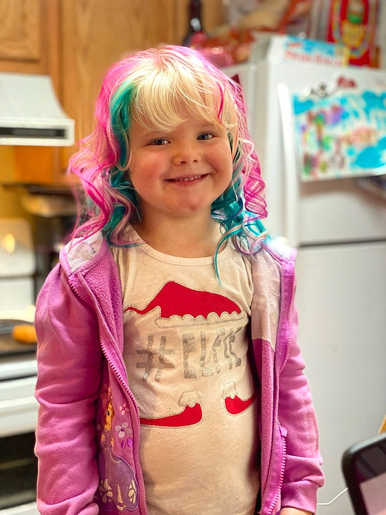Rileyann is registered to the contest to win money with this photo: bangs, chair, child, costume, event, fashion_accessory, fun, hair_coloring, happy, jewellery, joy, laugh, magenta, party_supply, person, pink, purple, room, sleeve, smile