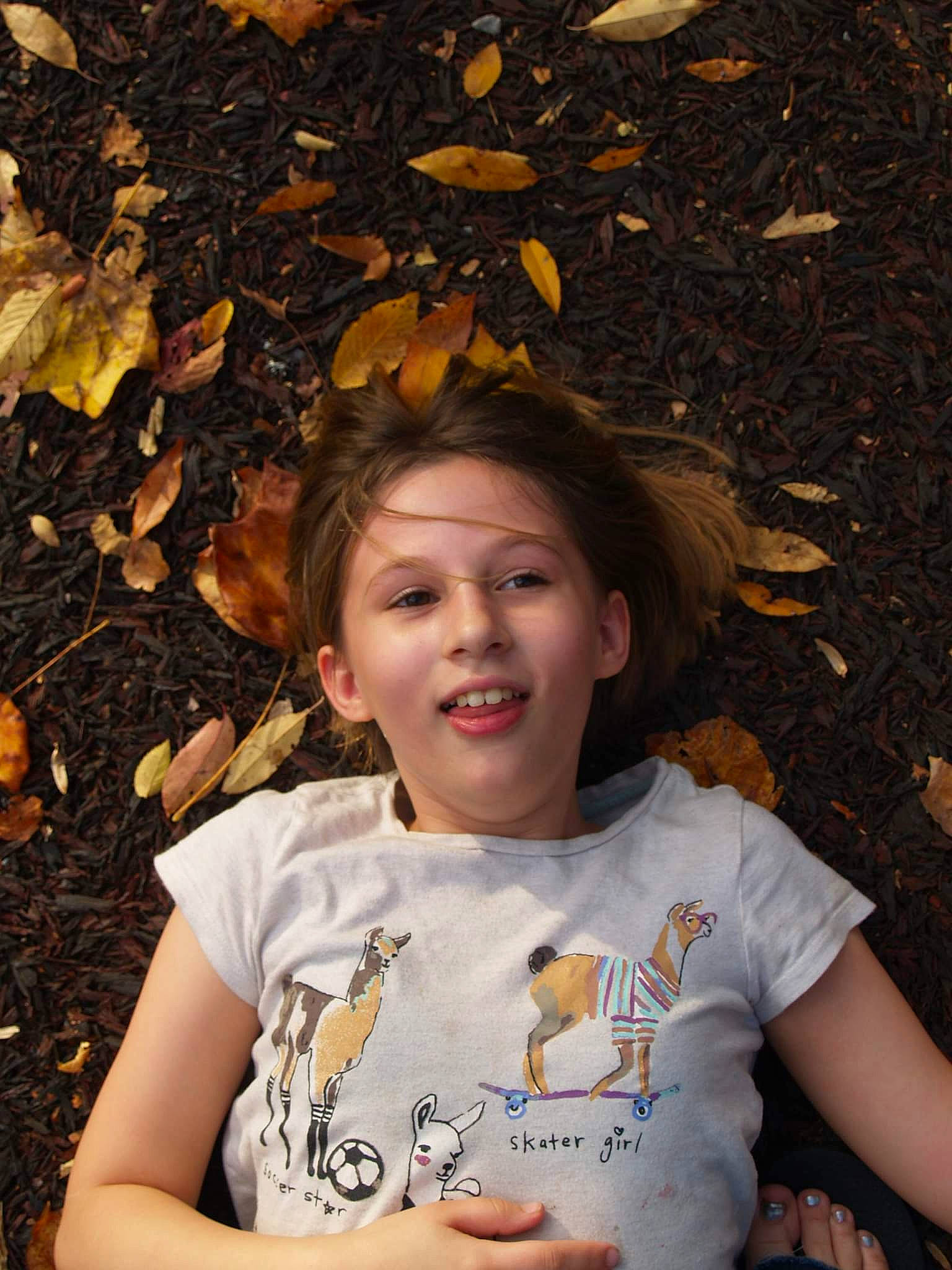 Alivia is registered to the contest to win money with this photo: chin, eye, facial_expression, flash_photography, fun, grass, hair, hairstyle, happy, head, human, leaf, nature, people, people_in_nature, person, sunlight, t_shirt, tints_and_shades, tree