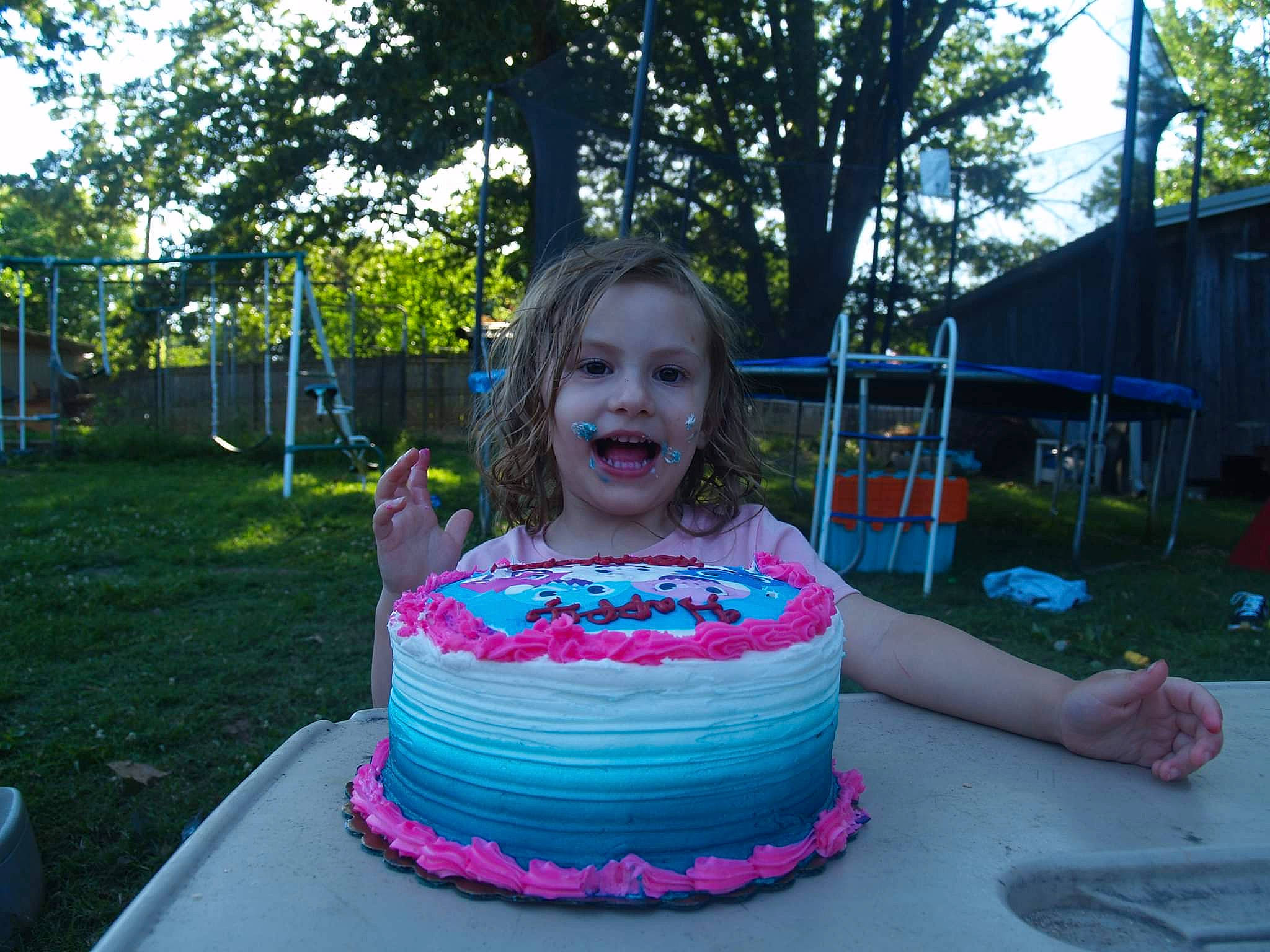 Haylee joined the competition — help win amazing prizes! baked_goods, birthday_cake, buttercream, cake, cake_decorating, cake_decorating_supply, dessert, event, food, fun, grass, leisure, magenta, person, pink, plant, recreation, smile, sugar_cake, toddler