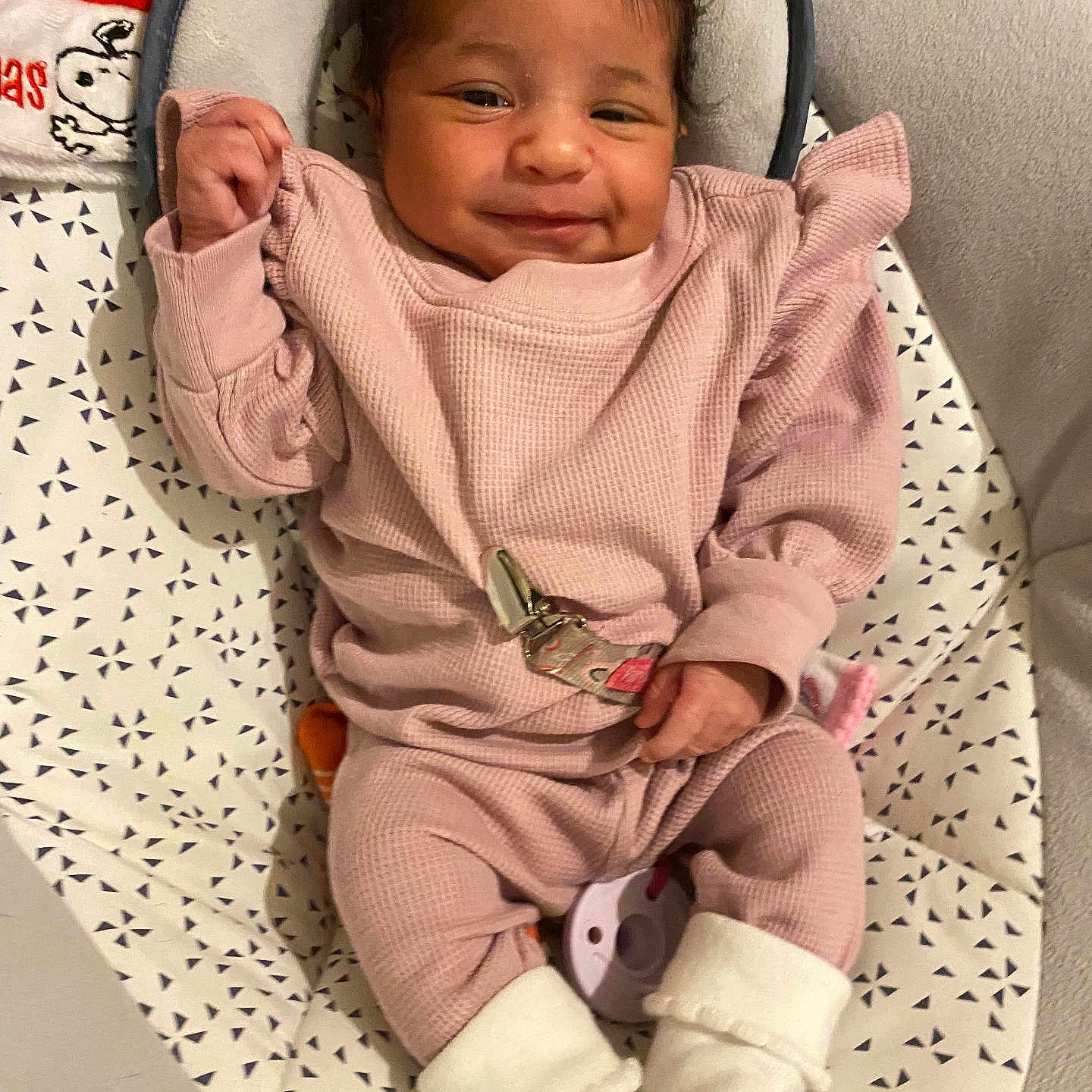 Tyleah joined the competition — help win amazing prizes! baby, baby_seat, child, cozy, cute, face, happy, indoor, infant, newborn, patterned_cover, person, pink_clothing, portrait, relaxed, small_hands, smile, soft_fabric, white_booties, young_child