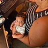 Adonis joined the competition — help win amazing prizes! baby, person, computer, keyboard, mouse, desk, striped_clothing, indoor, technology, workstation, holding, curious, black_hair, tattoo, earbud, carpet, office, closeup, child, adult