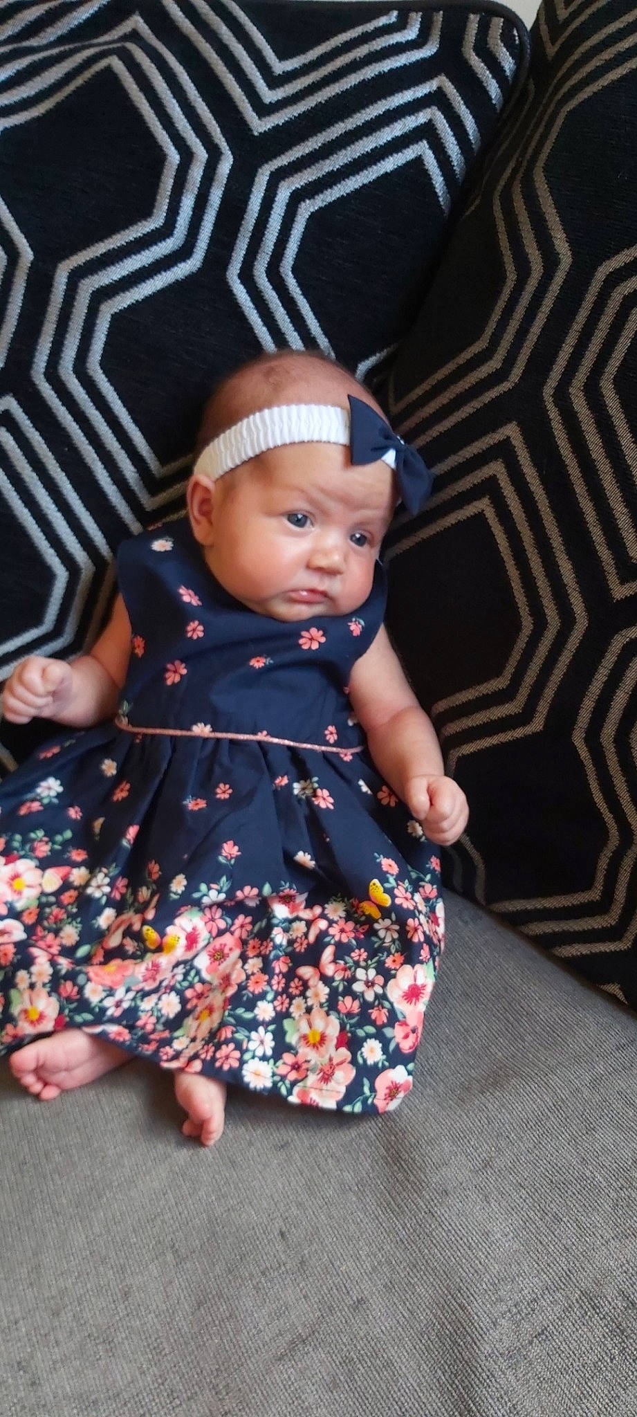 Layla-rose is registered to the contest to win money with this photo: baby, baby_toddler_clothing, child, dress, headgear, headwear, pattern, person, sitting, toddler