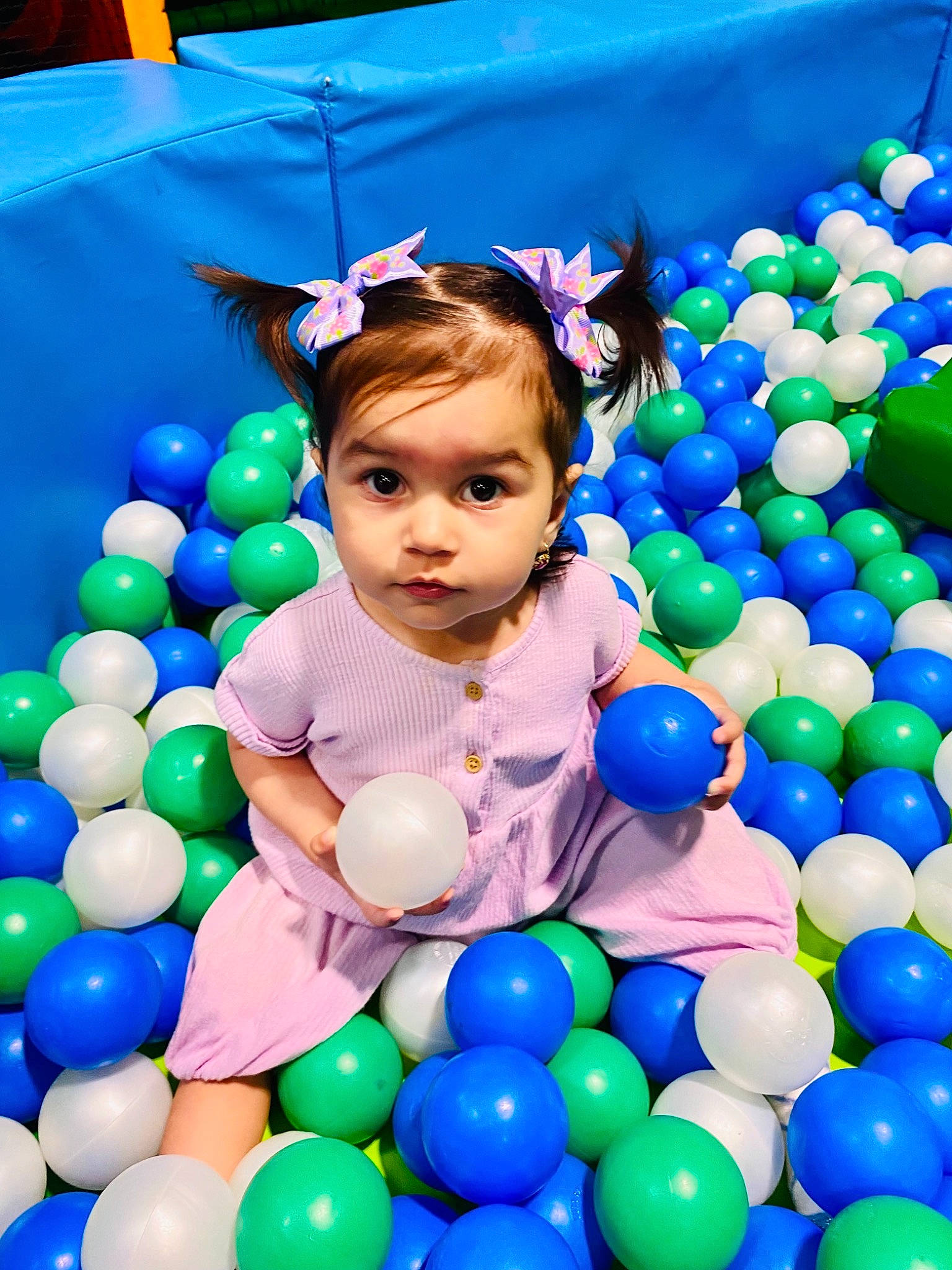 Bianca joined the competition — help win amazing prizes! ball, ball_pit, balloon, blue, child, clothing, dress, facial_expression, fun, happy, jeans, leisure, light, people, person, photograph, product, toddler, toy, white