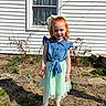 boots, bow, child, daytime, denim, dress, girl, grass, house, outdoor, plants, portrait, red_hair, shadow, skirt, smiling, standing, sunlight, tights, window