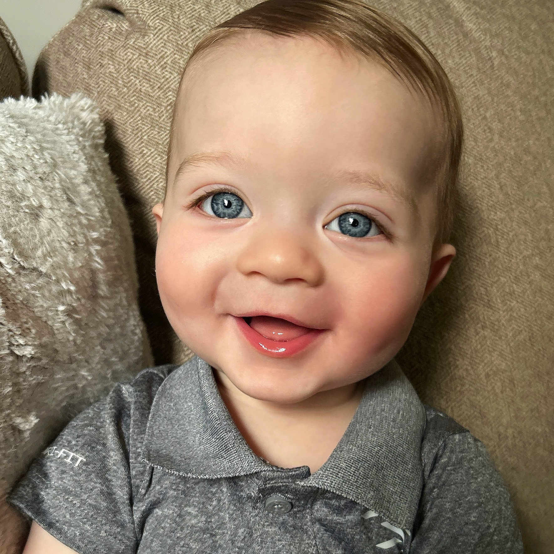 Lane joined the competition — help win amazing prizes! baby, babylaughing, blonde, bodypart, clothing, couch, face, furniture, hair, happy, head, homedecor, laughing, mouth, pants, person, photography, portrait, smile, teeth