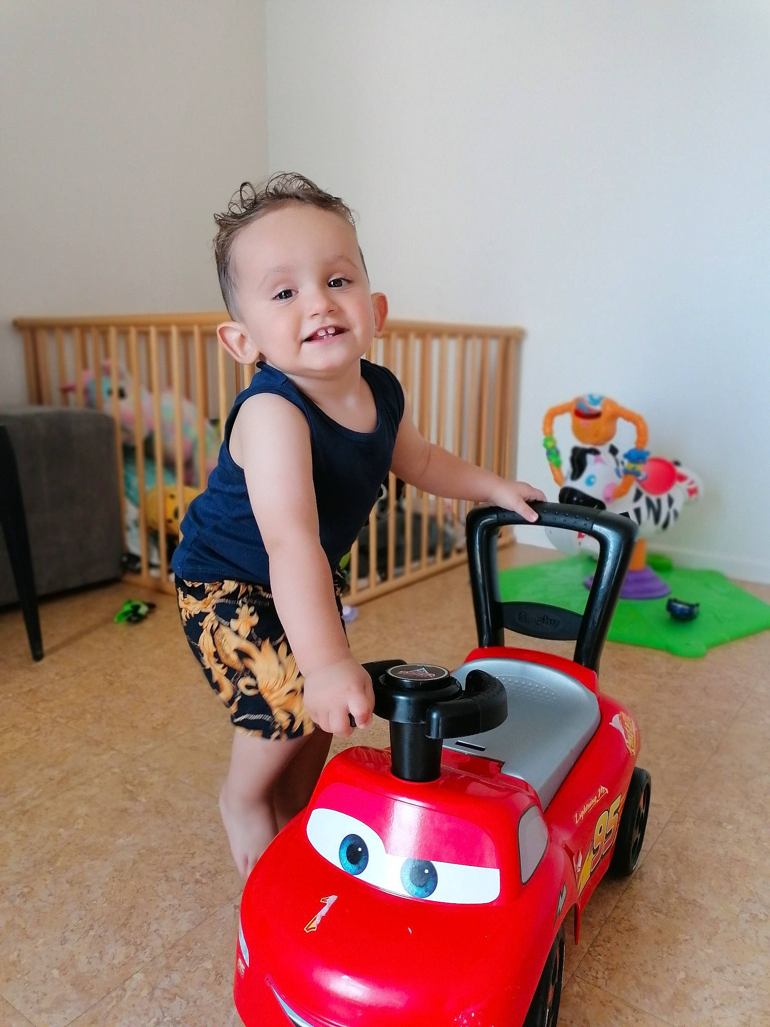 Marvin a rejoint le concours — aidez-le/la à gagner de superbes lots ! automotive_design, automotive_wheel_system, baby_playing_with_toys, baby_toddler_clothing, chair, child, cleanliness, flooring, fun, happy, joy, motor_vehicle, person, riding_toy, sitting, smile, tire, toddler, toy, toy_vehicle
