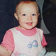 Summer joined the competition — help win amazing prizes! toddler, child, smiling, blue_eyes, pink_shirt, overall, sheep_embroidery, indoor, baby, cute, happy, person, clothing, face, head, sitting, young_child, portrait, infant, cheerful